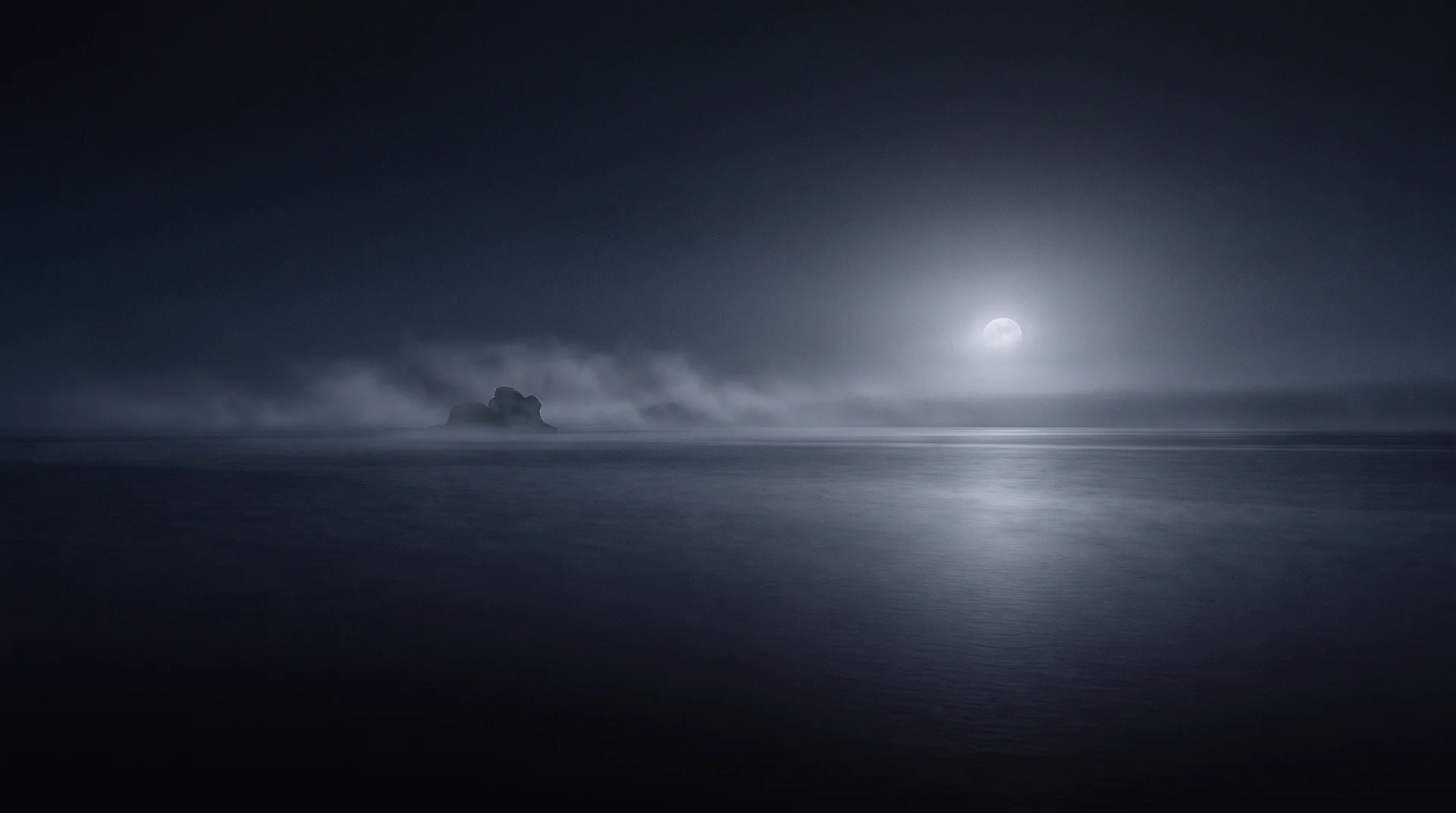 Moonlight reflected across a calm Nordic sea beneath low mist